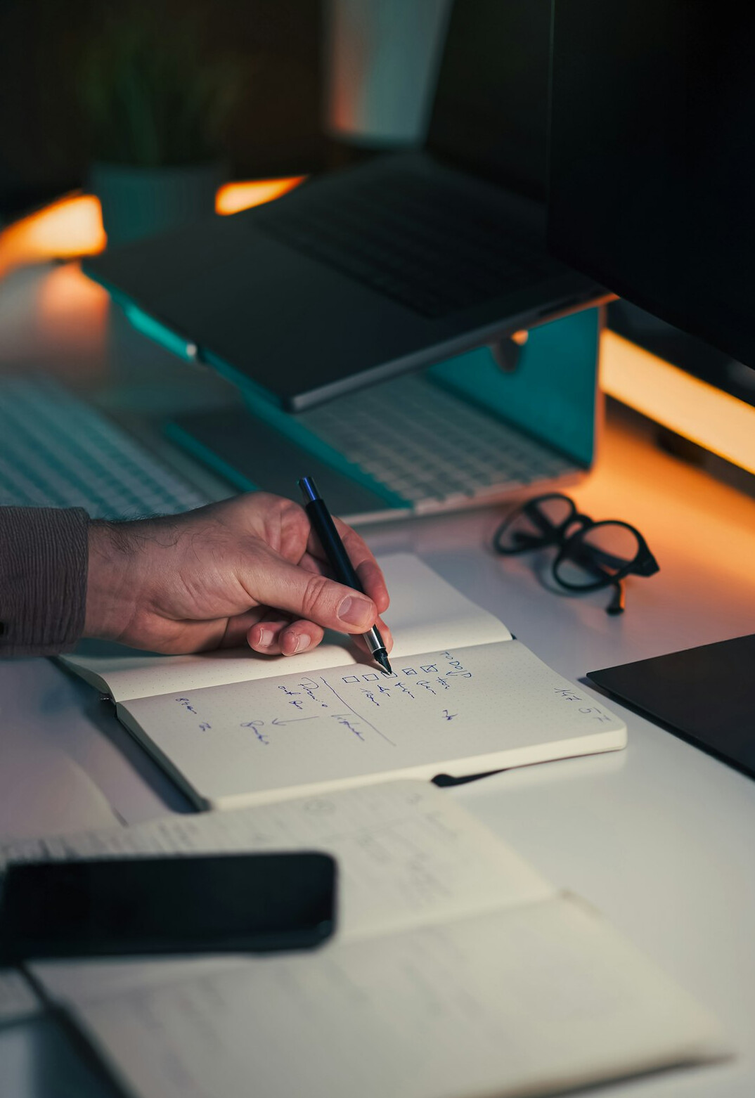 mystery writer at desk with notebook